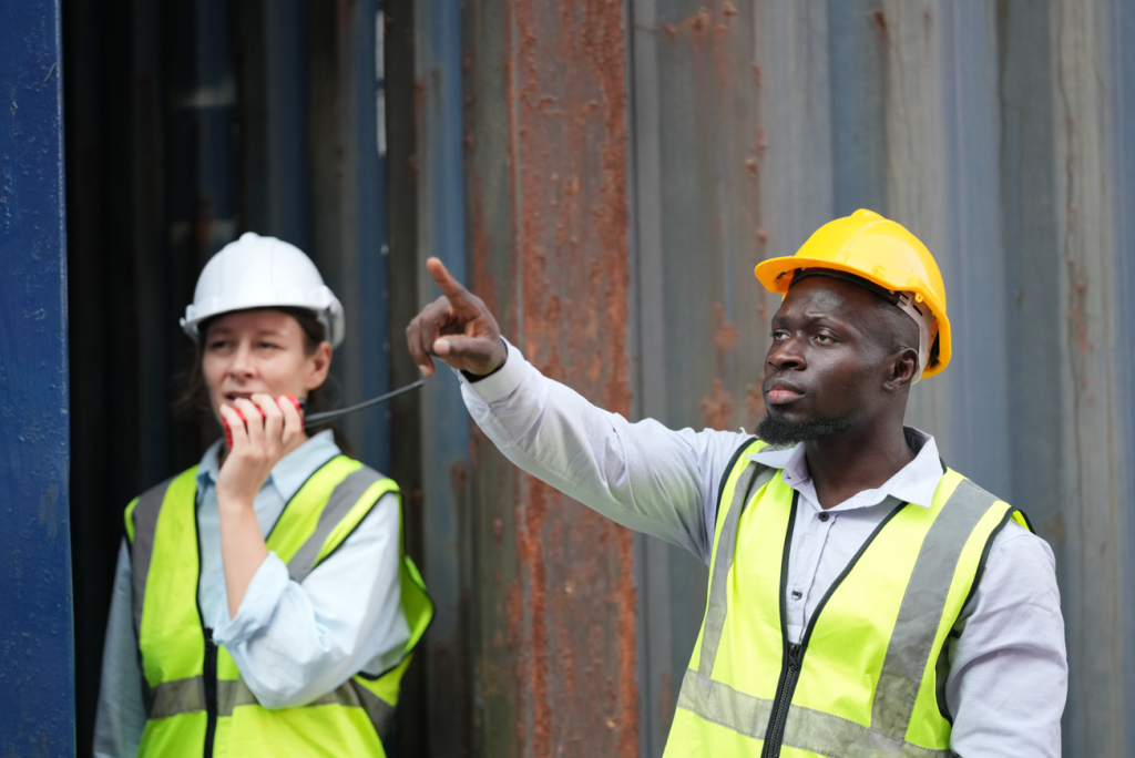 Construction worker pointing to something on site