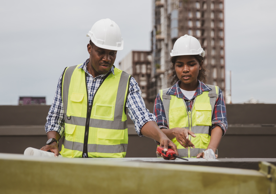 construction workers making plans on a building site