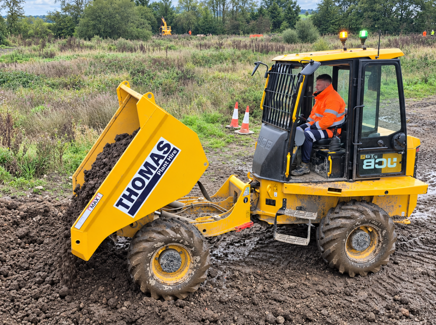 Operator in orange high-visibility clothing tipping soil from a yellow forward tipping dumper.